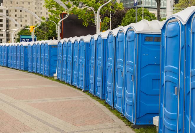 a row of portable restrooms set up for a special event, providing guests with a comfortable and sanitary option in Clovis, CA